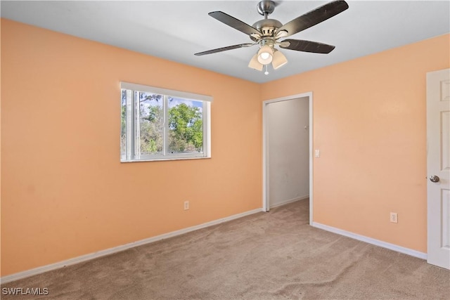 unfurnished bedroom with carpet, baseboards, and ceiling fan