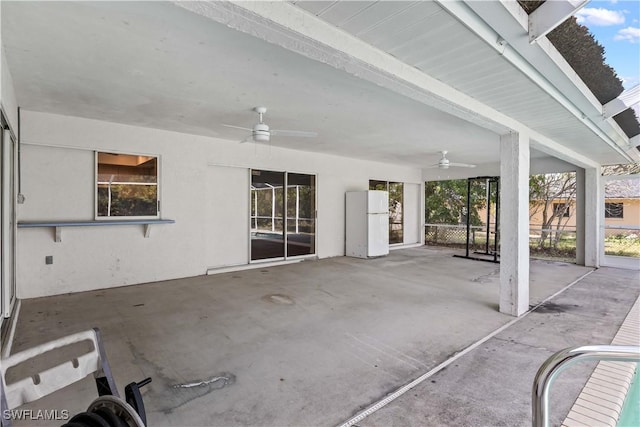 view of patio featuring ceiling fan