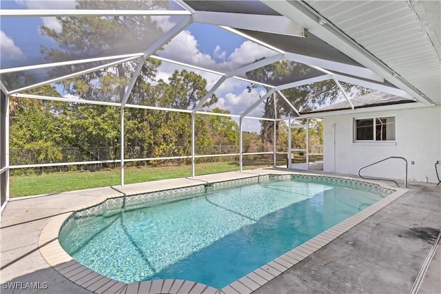 outdoor pool featuring a patio area, a lanai, and fence