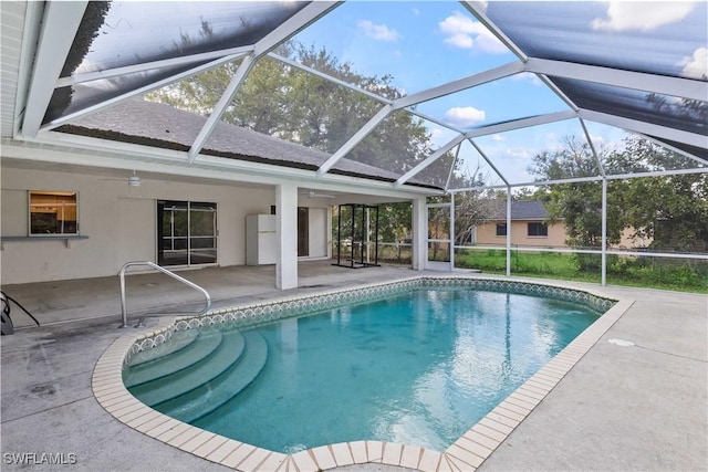 outdoor pool with a patio area and a lanai