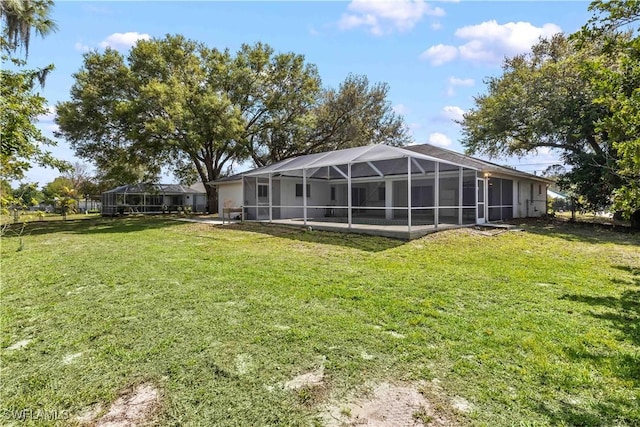 11253 Rabun Gap Dr, North Fort Myers, FL 33917 - view of green lawn with a lanai