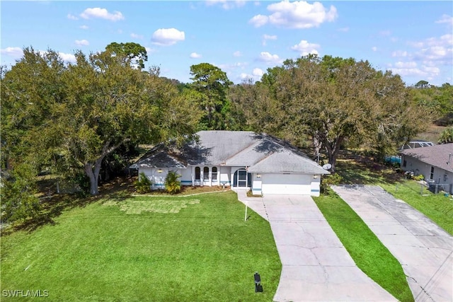 ranch-style house featuring a garage, a front yard, and concrete driveway