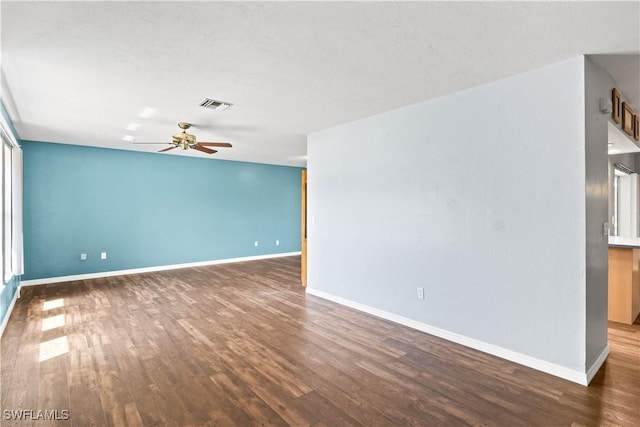 11253 Rabun Gap Dr, North Fort Myers, FL 33917 - spare room with ceiling fan, wood finished floors, and baseboards