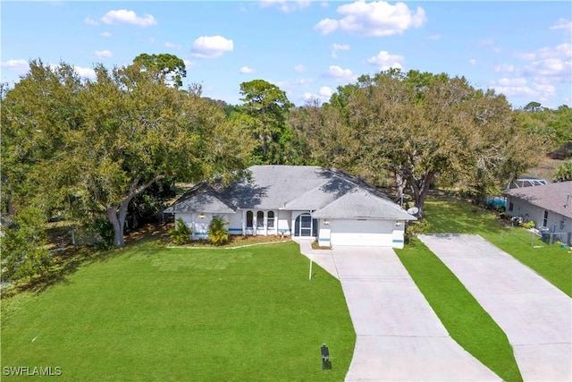 11253 Rabun Gap Dr, North Fort Myers, FL 33917 - view of front of home with concrete driveway, a front yard, and a garage