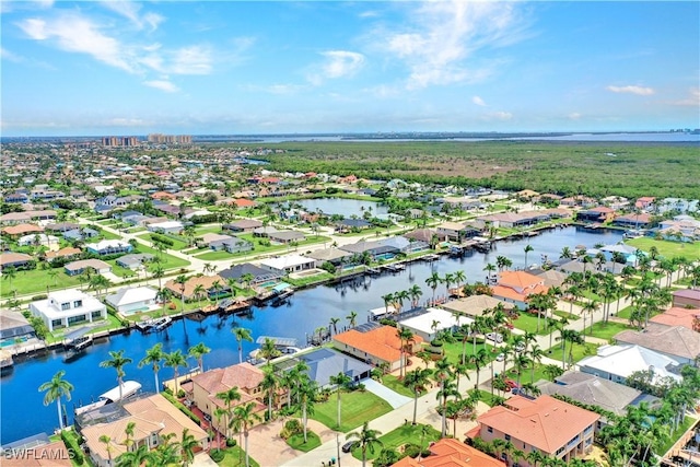 bird's eye view with a residential view and a water view