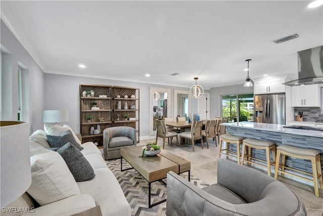 living area with visible vents and recessed lighting