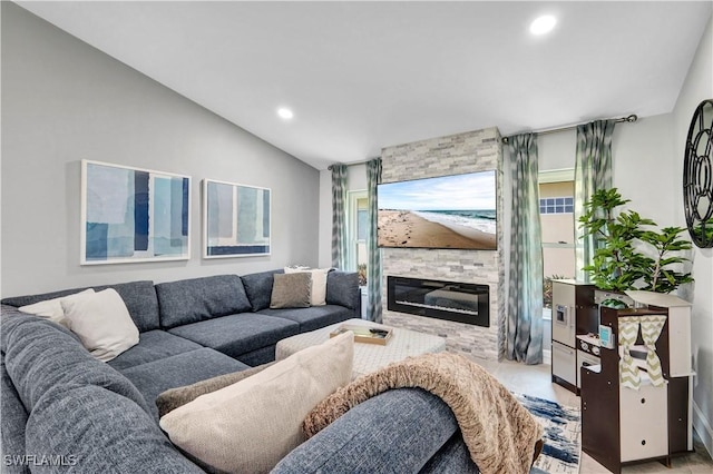 living room with a large fireplace, vaulted ceiling, and recessed lighting