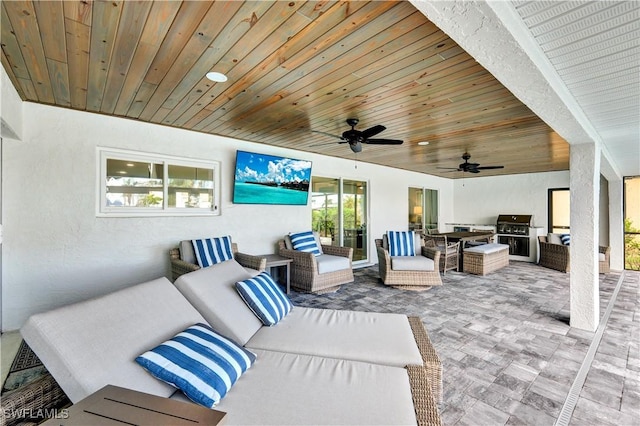 view of patio featuring an outdoor hangout area, a ceiling fan, and area for grilling