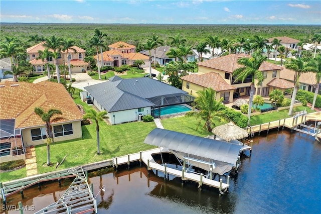 bird's eye view with a water view and a residential view