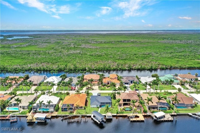 bird's eye view with a water view and a residential view