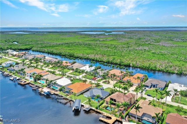 aerial view with a residential view and a water view