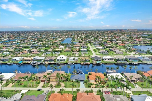 aerial view with a water view and a residential view