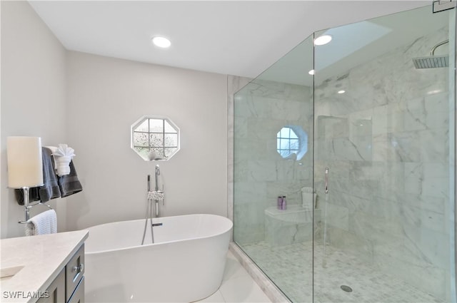 full bath featuring a soaking tub, recessed lighting, a stall shower, and vanity