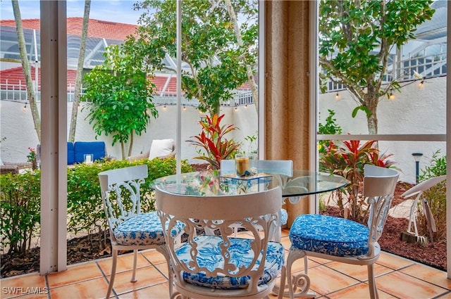 balcony with outdoor dining space and a patio area