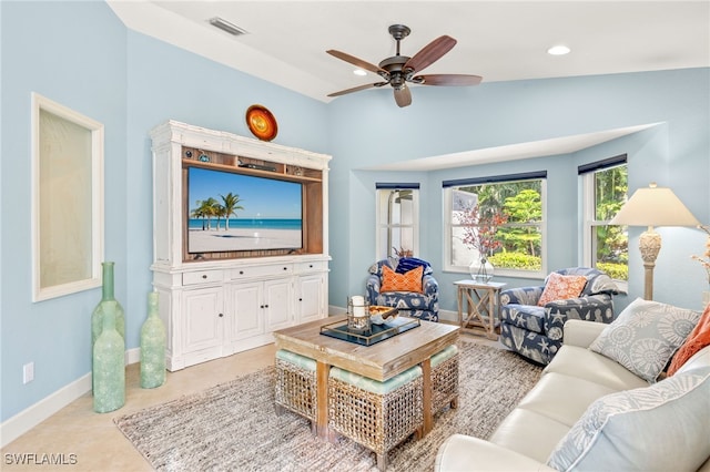 living area with light tile patterned floors, recessed lighting, visible vents, a ceiling fan, and baseboards