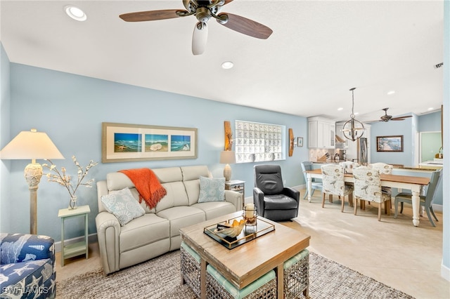 living area with baseboards, light tile patterned flooring, and recessed lighting