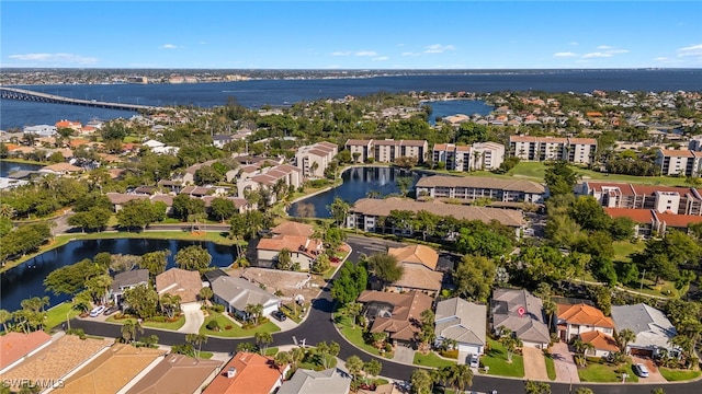 birds eye view of property featuring a residential view and a water view