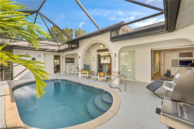 pool featuring a lanai and a patio