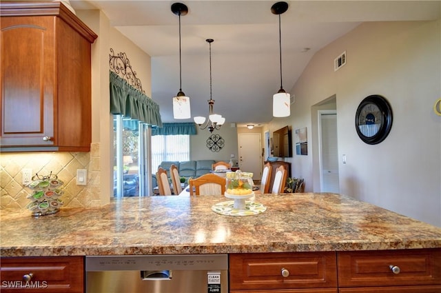 kitchen featuring visible vents, dishwasher, vaulted ceiling, decorative backsplash, and brown cabinetry