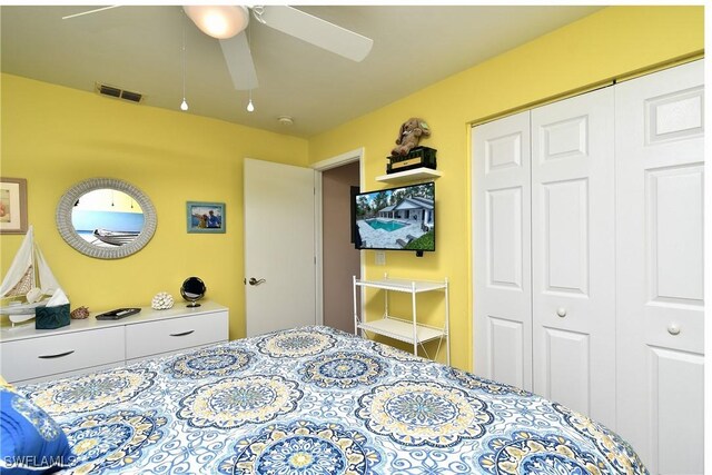 bedroom featuring visible vents, a closet, and a ceiling fan