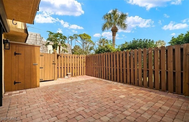view of patio / terrace featuring a gate and fence