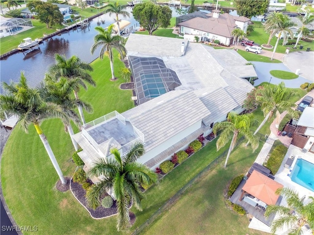 drone / aerial view featuring a residential view and a water view