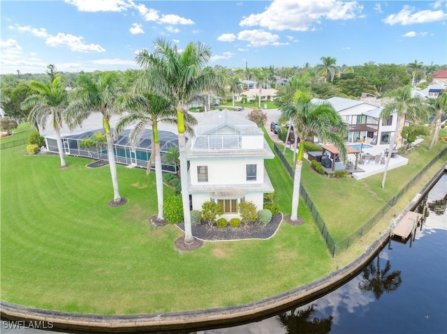 birds eye view of property featuring a water view and a residential view