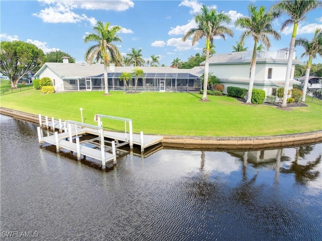 view of dock featuring a yard, a water view, and glass enclosure