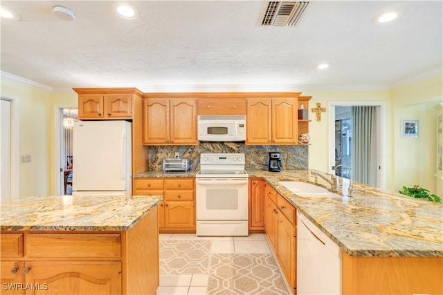 kitchen with light tile patterned floors, white appliances, a sink, visible vents, and ornamental molding