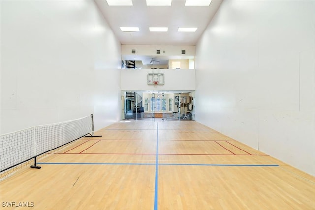 surrounding community with a sport court and visible vents