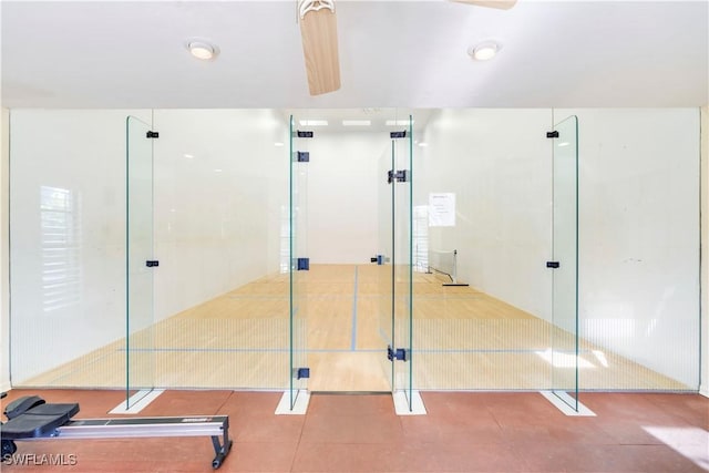 interior space with a sport court and tile patterned floors