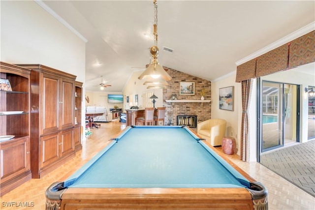 game room featuring billiards, visible vents, lofted ceiling, ornamental molding, and a brick fireplace