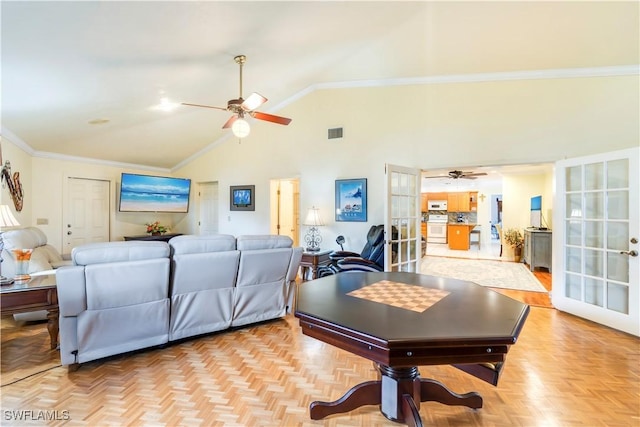 living room with ceiling fan, high vaulted ceiling, visible vents, french doors, and crown molding