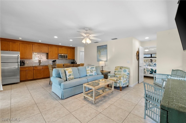 living room featuring recessed lighting, visible vents, ceiling fan, and light tile patterned flooring