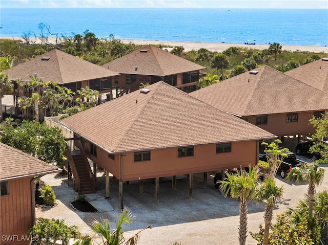 bird's eye view with a beach view and a water view