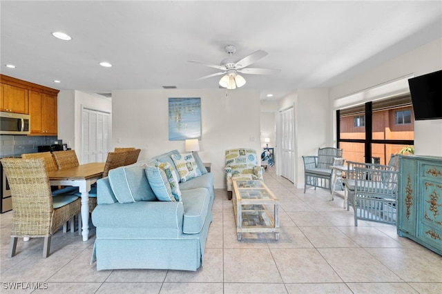 living room with recessed lighting, light tile patterned floors, a ceiling fan, and visible vents