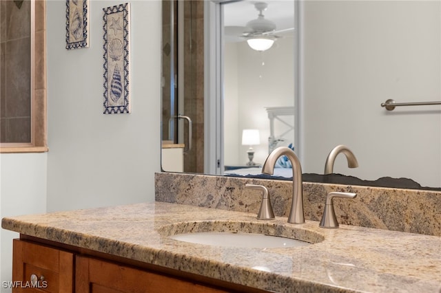 bathroom with vanity and a ceiling fan