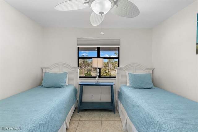 bedroom with tile patterned flooring and ceiling fan