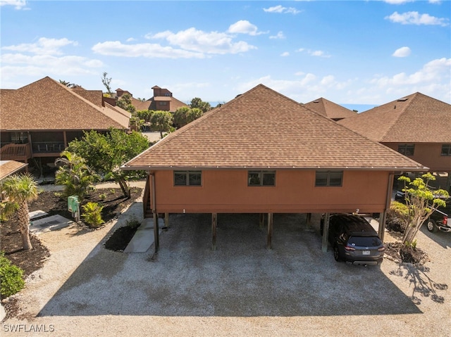 view of property exterior featuring a shingled roof