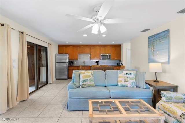 living area with recessed lighting, visible vents, light tile patterned flooring, and a ceiling fan