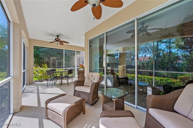 sunroom featuring a ceiling fan