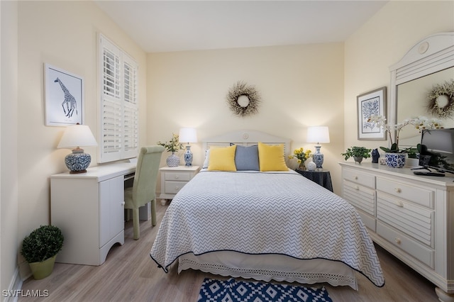 bedroom with light wood finished floors