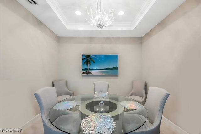 dining room with baseboards, ornamental molding, an inviting chandelier, a tray ceiling, and recessed lighting