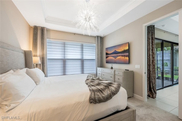 bedroom with access to exterior, a raised ceiling, light carpet, and a chandelier