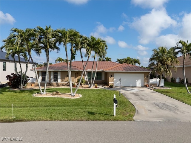 ranch-style house with a front yard, a garage, driveway, and stucco siding