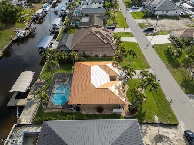 birds eye view of property featuring a residential view and a water view