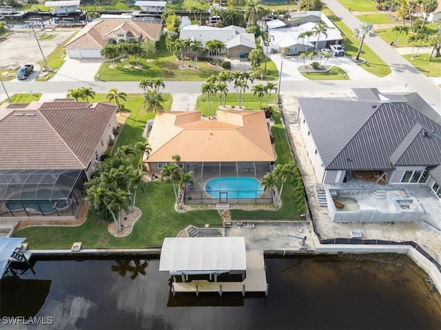 birds eye view of property with a residential view and a water view