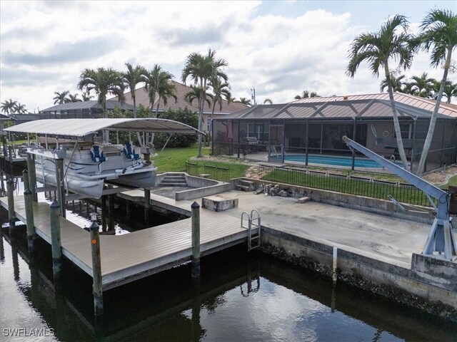 view of dock featuring glass enclosure, a community pool, and boat lift