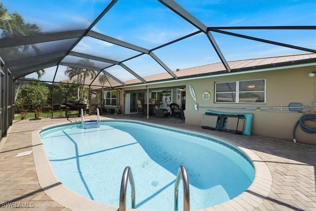 pool featuring a lanai and a patio