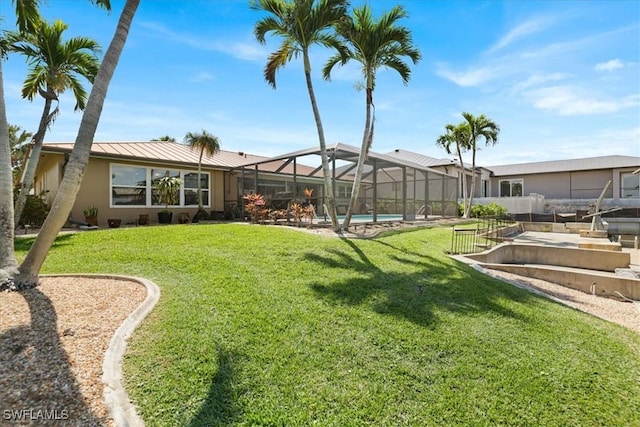 view of yard featuring an outdoor pool and glass enclosure